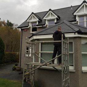 one of our team fixing a customers roof