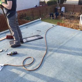 flat roof with sweeping brush